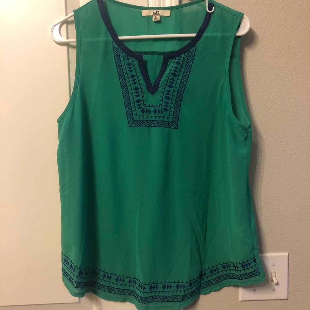 Green blouse with blue embroidery